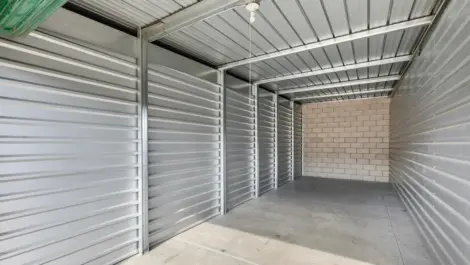 Interior of a storage concrete & metal walled storage unit.