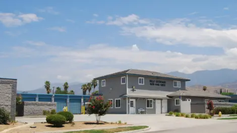 Blue doored storage units and a self storage office.