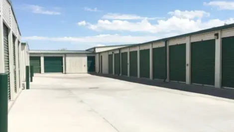 Outdoor storage units with a white road.