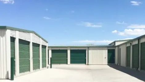White and green outdoor storage units.